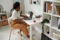 Professional workspace with laptop and digital planning wall