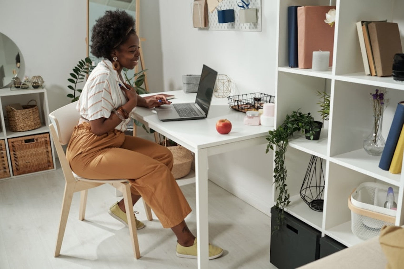 Professional workspace with laptop and digital planning wall